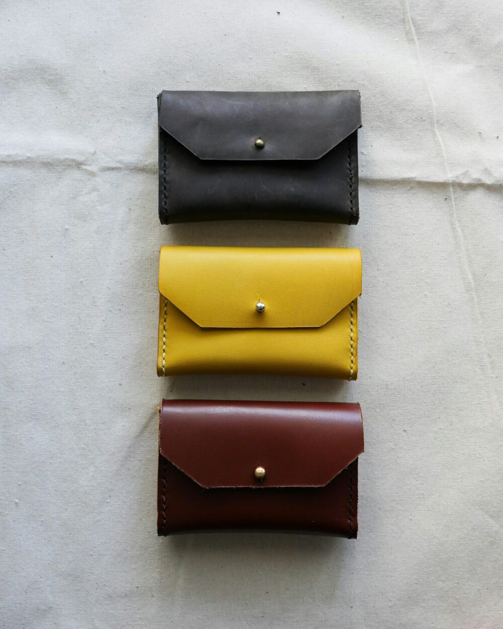 The card holder in each of its colours