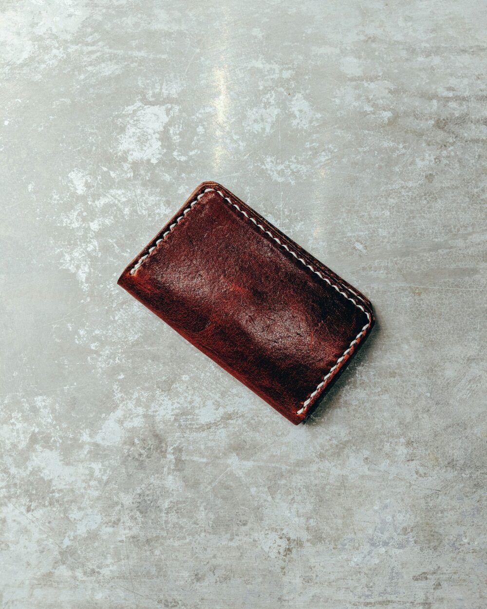 The card holder resting on stone
