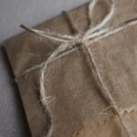 A kraft paper parcel tied with twine, photographed on arrival