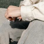 A rolled linen cuff, photographed while seated